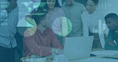 Collaborating group of seven professionals analyzing metrics in conference room, with silver laptop. Team, teamwork, data, analysis, strategy, brainstorming, corporateの写真素材