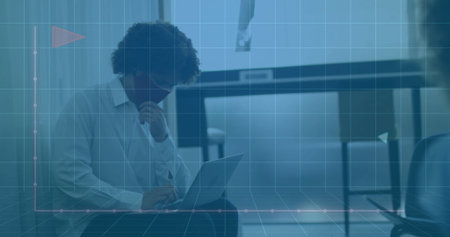 Man wearing face mask, white shirt typing on laptop in lounge, with grid overlay, copy space. Technology, communication, workspace, digital, professional, modern, businessの写真素材