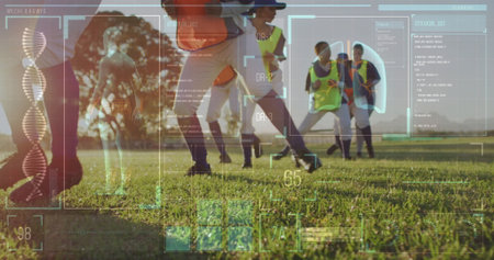 Female soccer players practicing in neon bibs, cleats on sunlit grass field. Athleticism, teamwork, innovation, technology, outdoor, sports, fitnessの写真素材
