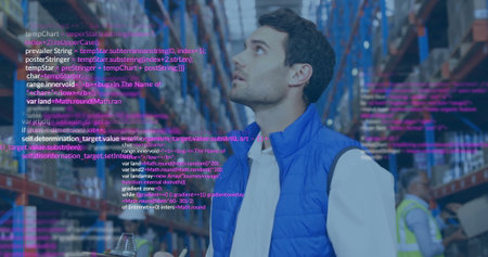 Scanning metal box racks in blue quilted vest, holding tablet in warehouse aisle, with code overlay. Logistics, inventory, technology, automation, industrial, efficiency, operationの写真素材