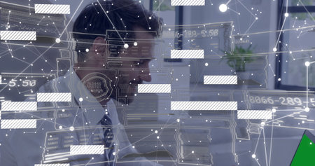 Analyzing data overlays man wearing striped tie working at desk in modern office, with monitors....