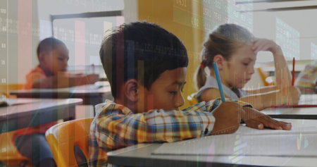 Writing three classmates analyzing data in bright classroom, with pencils and chart overlay. Education, learning, students, school, academic, development, knowledgeの写真素材