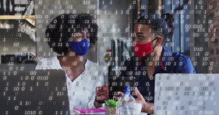 Discussing project two masked colleagues using laptops in cafe, with succulent and binary overlay. Collaboration, productivity, modern, business, workspace, teamwork, innovationの写真素材