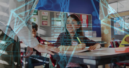 Smiling girl with headband writing on notebook in classroom near windows, holographic code overlay. Education, learning, technology, innovation, classroom, students, futureの写真素材