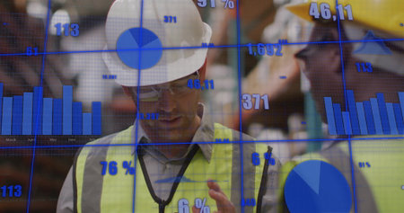Checking handheld device, worker in white hard hat inspecting warehouse shelves, with data overlays....