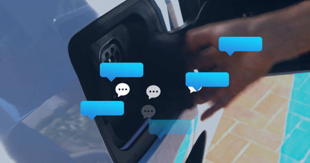Inserting EV charging connector into car port at outdoor parking spot, with chat bubble overlay. Electric, connectivity, technology, sustainability, urban, modern, innovationの写真素材