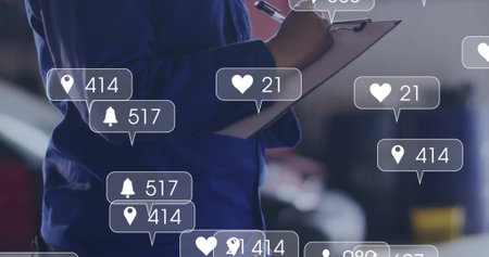 Female tech wearing coveralls inspecting vehicle in garage with clipboard, pen and digital icons. Technician, automotive, industrial, maintenance, digital, futuristic, professionalの写真素材