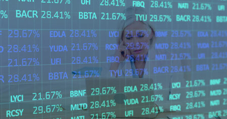 Focusing financial analyst balancing smartphone and laptop in office, with live market data overlay....