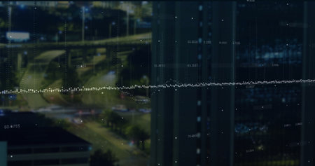 Displaying dotted line grid overlay in office at night, with highway lights and reflective facade....