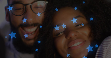 Smiling romantic couple leaning together in dark background, with eyeglasses and blue star overlays. Romance, connection, affection, celebration, digital art, vibrant, unityの写真素材