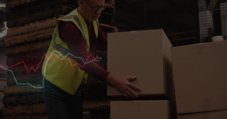 Lifting warehouse worker stacking cardboard boxes on pallets in warehouse, safety vest, copy space....