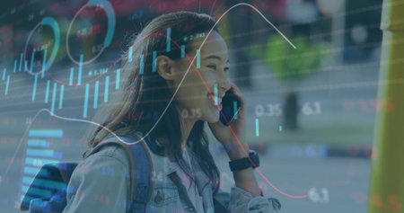 Talking woman checking smartphone data at bus stop, with denim jacket, backpack and chart overlays. Urban, technology, analytics, communication, modern, professional, dynamicの写真素材