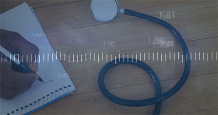 Displaying measurement overlay on wooden desk with stethoscope pen writing in spiral bound notebook. Medical, clinician, healthcare, examination, diagnostic, analysis, researchの写真素材