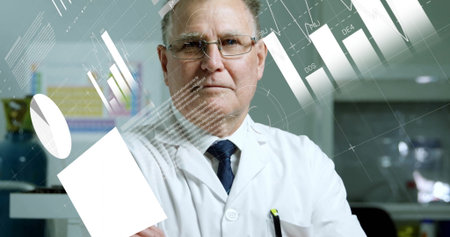 Analyzing holographic charts, senior scientist in lab coat and tie holding display panel in lab. Futuristic, innovation, analytics, technology, education, professional, academicの写真素材