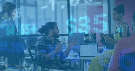 Gesturing man with bun and plaid shirt leading discussion in modern office, floating stock ticker. Collaboration, teamwork, brainstorming, innovation, communication, professional, diversityの写真素材