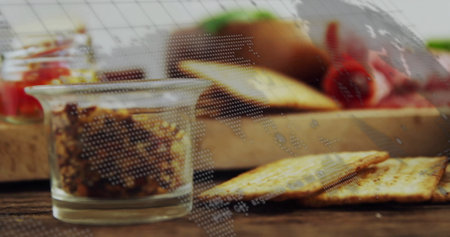 Showing glass jar holding brown spread on wooden kitchen tabletop with crackers and red bell pepper. Gourmet, wholesome, rustic, textured, culinary, natural, appetizingの写真素材