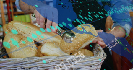 Handling bagel bakery worker in blue long-sleeve shirt using tongs at bakery shop, digital overlay....