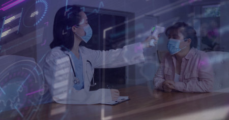 Taking doctor measuring patient temperature in exam room, with infrared thermometer, copy space. Medical, healthcare, diagnostics, clinical, wellness, professionalism, sterileの写真素材