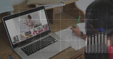 Child writing on paper with pencil while laptop in home study showing teacher wearing blazer, mug. Remote learning, education, online classroom, digital training, study environment, distance teaching, youth learningの写真素材