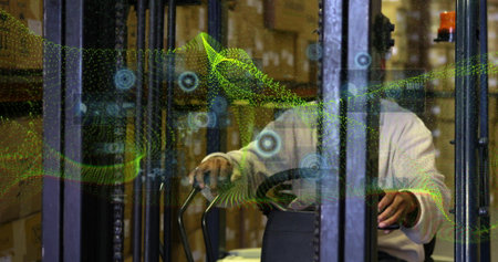 Driving forklift operator wearing sweater scanning box-filled shelves in warehouse, with AR overlay. Industrial, logistics, automation, warehouse, inventory, technology, efficiencyの写真素材