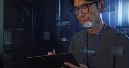 Korean technician monitoring server racks in server room, with tablet stylus and holograms....