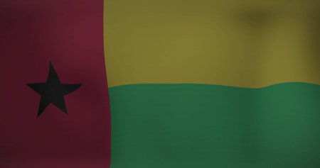 Displaying national flag of Guinea-Bissau fluttering against neutral plain backdrop, fabric detail. Patriotism, symbolism, textile, fabric, decoration, vibrant, culturalの写真素材
