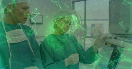Two surgeons monitoring vital signs on console in surgery room, with surgical caps and gowns. Medical, healthcare, technology, clinical, diagnostic, teamwork, advancedの写真素材
