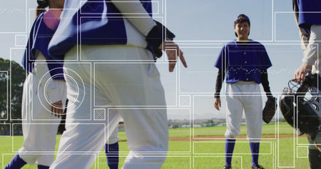Smiling center player holding glove on diamond with teammates wearing blue jerseys. Athletics, teamwork, youth, outdoor, sportsmanship, competitive, activeの写真素材