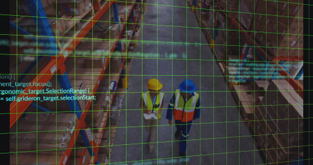 Walking two colleagues wearing safety vests navigating high-bay aisle with boxes, digital overlay....
