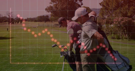 Walking partners in polos carrying bags on fairway, copy space. Sports, leisure, outdoor, landscape, teamwork, confident, energeticの写真素材