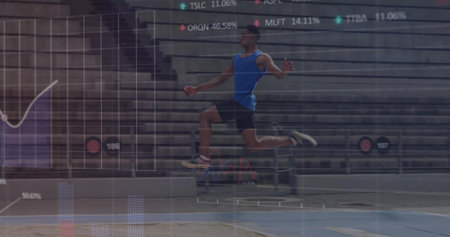 Launching male athlete performing long jump toward sand pit on track in stadium, with data overlay. Athletics, sports, performance, competition, fitness, endurance, visualizationの写真素材
