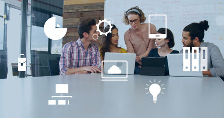 Team of five professionals collaborating in meeting room, with laptops, tablet, digital icons....