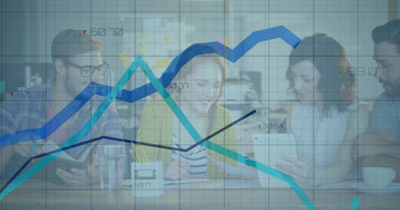 Collaborating team in business attire analyzing data on tablet at meeting table, with line graphs. Team, collaboration, analytics, digital, workspace, professional, modernの写真素材
