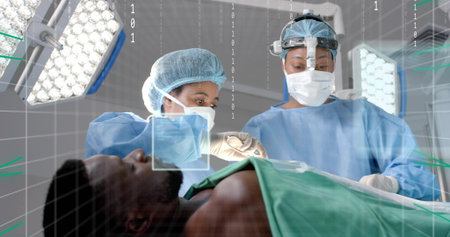 Female surgeons performing surgery in OR, with green drape, LED lights and digital overlay. Medical,...