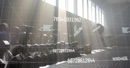 Black kettlebells sitting on rack in gym with panels, basket and data grid with floating codes. Strength, fitness, industrial, technology, modern, training, exerciseの写真素材