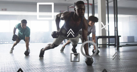Performing plank row African American man gripping dumbbell near gym windows, with overlay graphics....