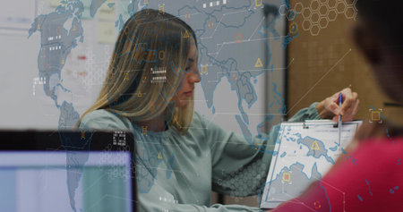 Data analyst in blouse marking world map with pen in meeting room, digital overlays hovering....