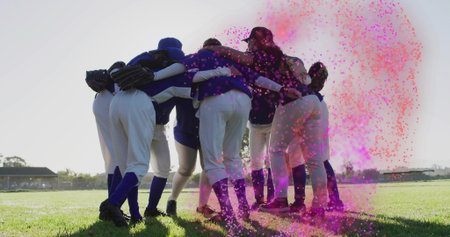 Forming huddle seven female baseball teammates bending inward on grass, wearing gloves. Team, camaraderie, unity, athleticism, outdoor, vibrant, determinationの写真素材
