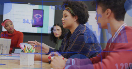 Discussing woman in blue plaid shirt presenting data in conference room, with digital display....