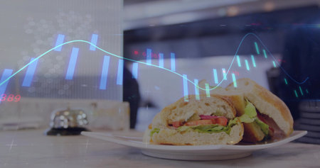 Presenting sandwich on plate sitting on countertop in cafe with bell, plates, chart overlay. Gourmet, hospitality, modern, business, innovation, casual, presentationの写真素材