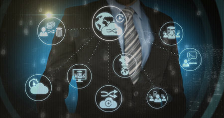 Interacting businessman wearing suit raising hand at data center, with globe and cloud icons. Technology, innovation, connectivity, digital, enterprise, futuristic, networkingの写真素材