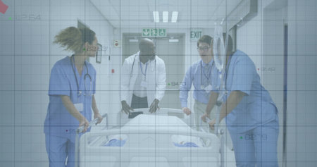 Walking medical team wearing scrubs and lab coat pushing gurney in hospital corridor with exit sign....