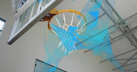 Capturing basketball hoop under gym truss ceiling, with clear backboard white nylon net and arm. Sports equipment, athletic facility, indoor arena, fitness, competition, exercise, urban designの写真素材