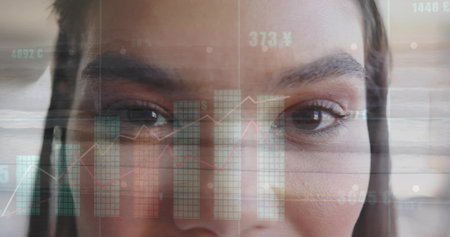 Analyzing mid adult woman engaging with financial data overlays at office desk, digital interface. Digital, analytics, futuristic, technology, professional, data visualization, corporateの写真素材