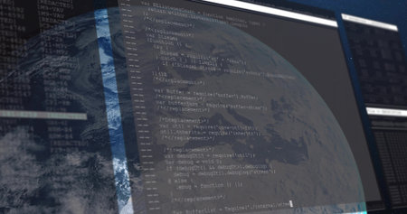 Displaying code editor showing JavaScript code over globe on computer monitor, with dark interface....