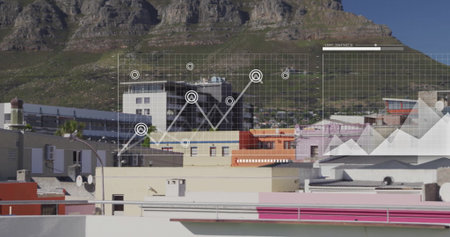 Displaying pastel rooftops lining city block at mountain base, with translucent grid and line graph. Cityscape, data visualization, digital interface, technology, modern, infrastructure, aerialの写真素材