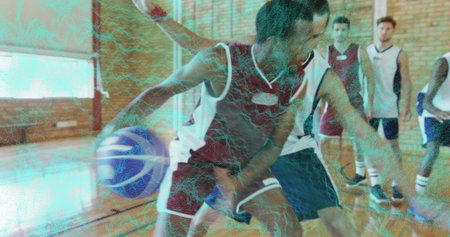 Dribbling athlete wearing red-and-white jersey in gymnasium, with basketball and court lines. Action, competition, athleticism, team, exercise, sport, intensityの写真素材
