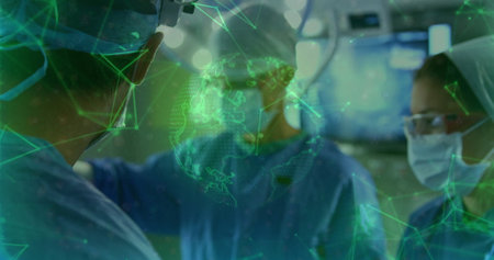 Examining three surgeons in blue gowns and masks observing hologram in OR, with telemedicine. Medical, innovation, futuristic, collaboration, technology, healthcare, precisionの写真素材