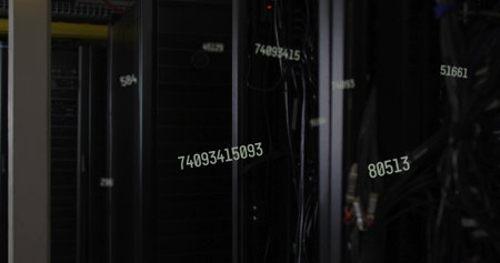 Displaying central server rack with servers and cables in data center aisle, with numeric overlays. Technology, data, infrastructure, cybersecurity, networking, industrial, futuristicの写真素材
