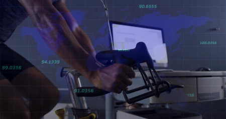 Pedaling cyclist gripping aero handlebars in office workstation, world map and metrics overlaying....